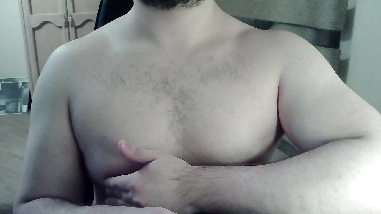 Hot beefy camboy shows off the goods during a show