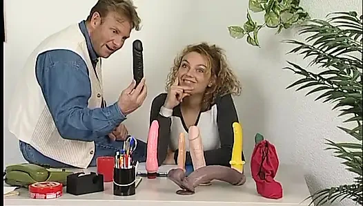 Blonde teen gets pussy fingered in the room full of dildos