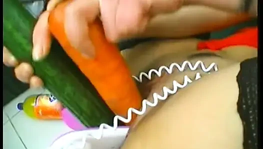 Brunette mature slut wearing stockings while drilling her holes with food and huge candle