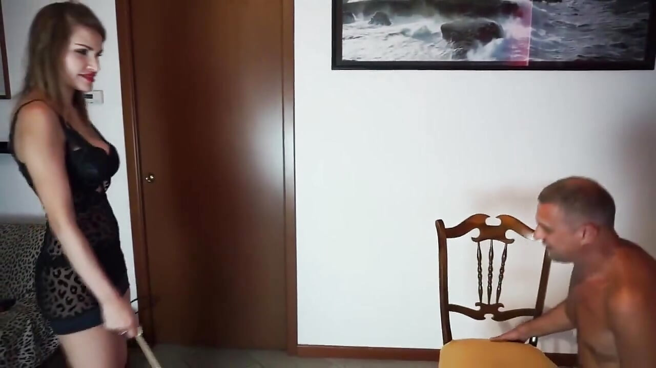 Sexy Femdom Mistress Dominates Naked Slave with Whip