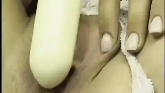 Serena Marcus bends over on sofa and fucks her cunt with a dildo
