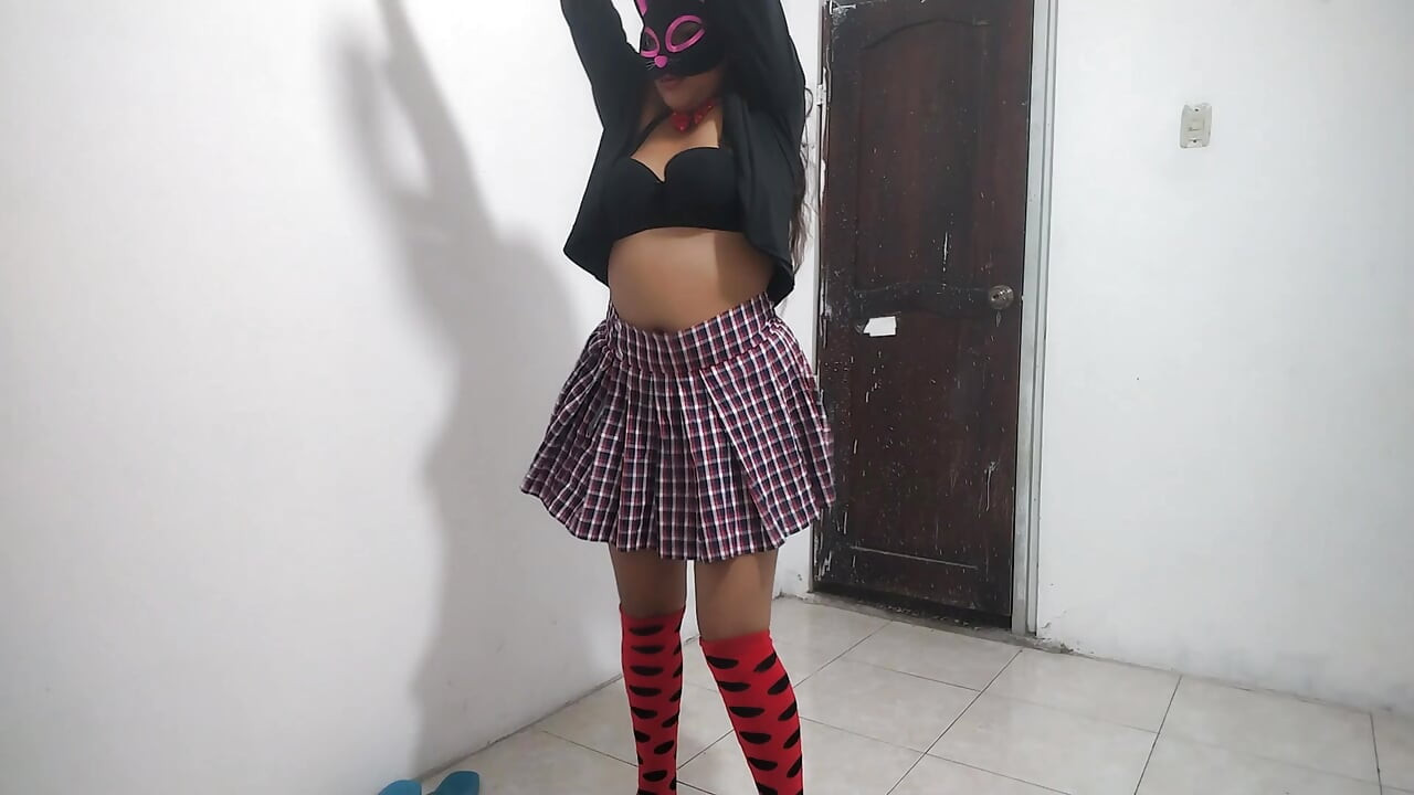 The busty student dances sexily in her apartment. She's an 18-year-old brunette.