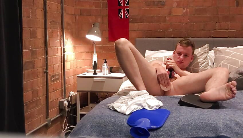 Twink fucks himself with a dildo showing his feet