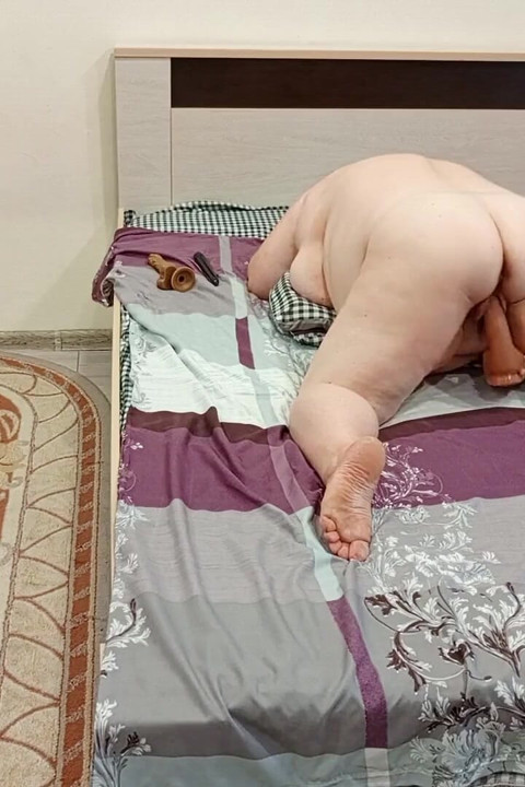 A Big Dildo in the Fleshy Pussy of a Mother-in-law