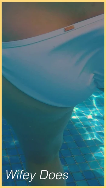 Wifey swims in the pool with perfect body
