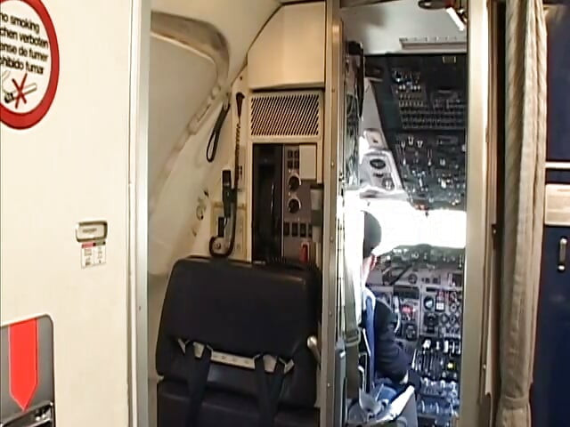 Randy pilot fondles sexy brunette in the cockpit