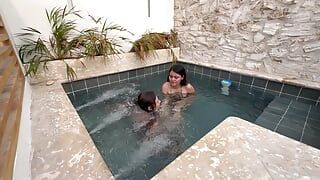 Two hot lesbians masturbate in a public swimming pool, afraid of being discovered.