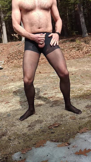 Jerking off outside in black pantyhose