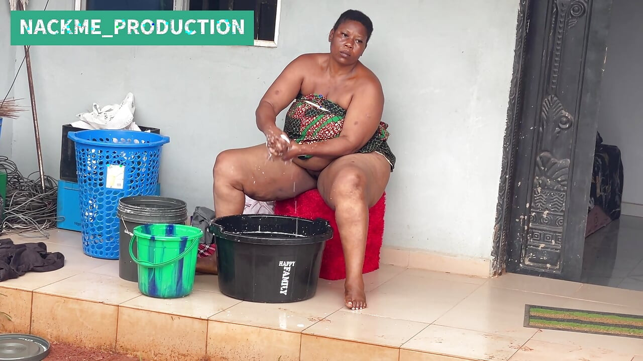 African Mama Multitasks on a Sunday Morning