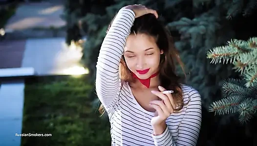 Sultry Russian Girl Smoking Cigarette by Waves