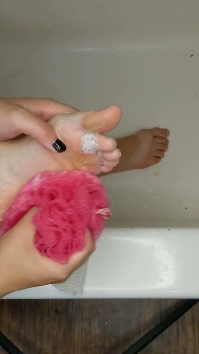 Washing and scrubbing my dirty feet