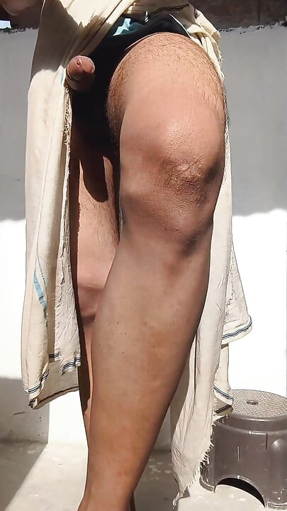 Young guy rubs his thick penis with oil