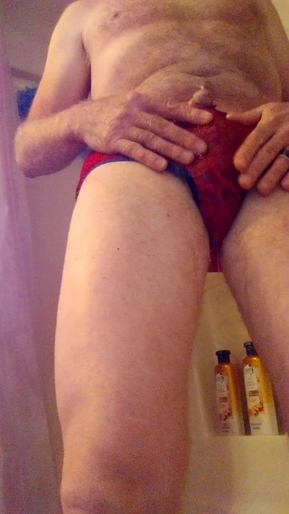 Pissing in red lace panties