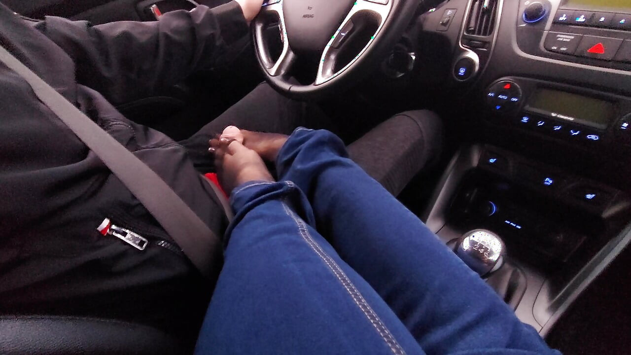 Amateur MILF in jeans and nylon socks gives a taxi driver a footjob