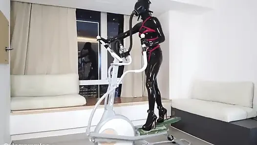 Mz27 - a Girl Bound in Latex Walks on a Treadmill