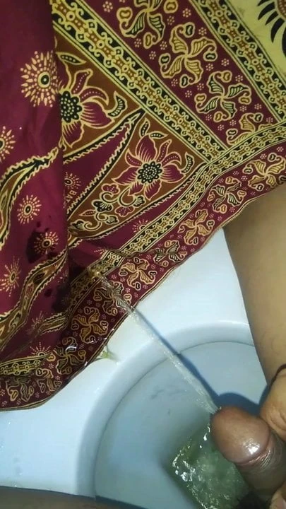 Pissing on mother in law lungi