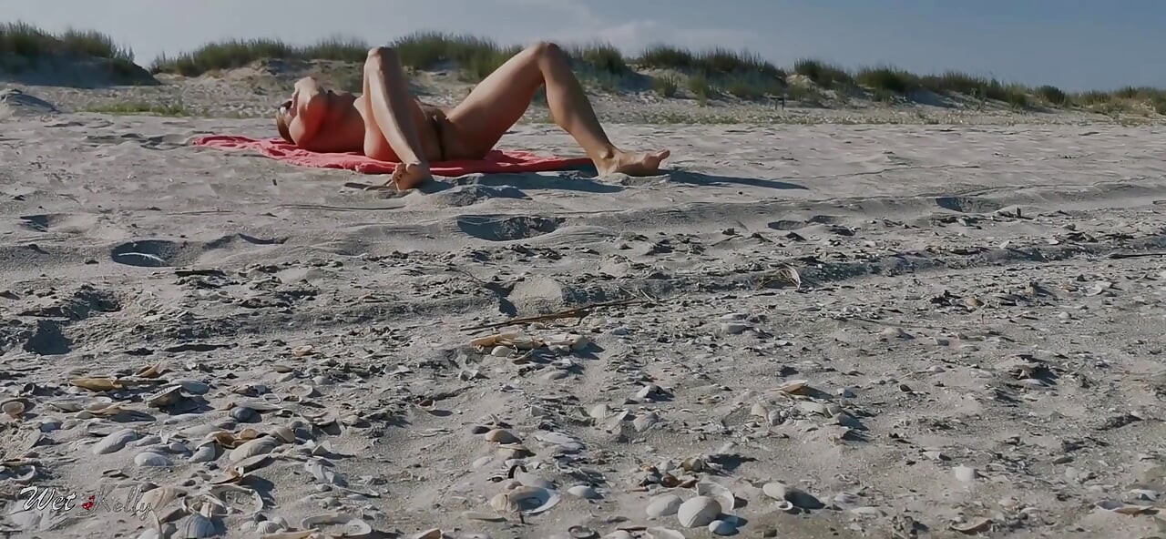 Hot MILF Masturbating on the Nudist Beach Got Caught on Camera