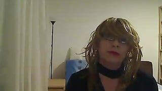 horny MILF tranny in front of the camera simulates a Blowjob while playing with a vibrator