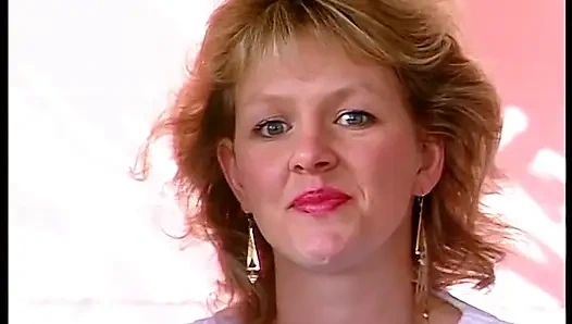 Cute blonde chick enjoys filling her pussy with a big dildo