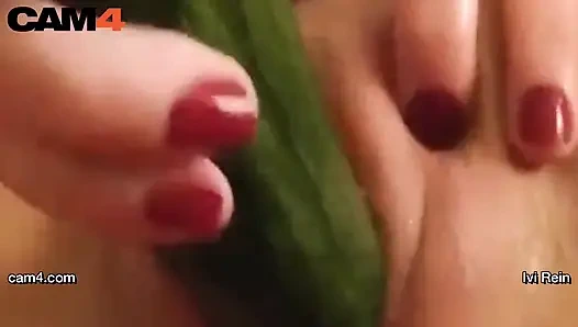 Webcam hottie Ivi Rein toys herself with a long cucumber