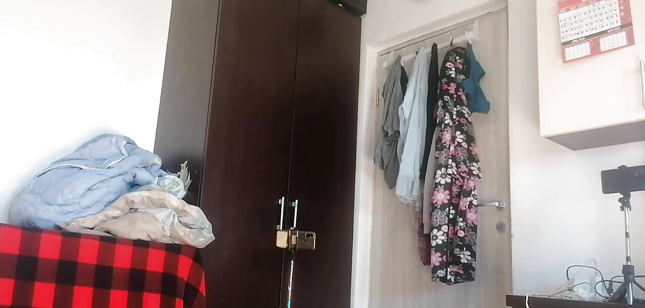 Sexy Latina Having Fun Trying on Clothes and Cutting Them
