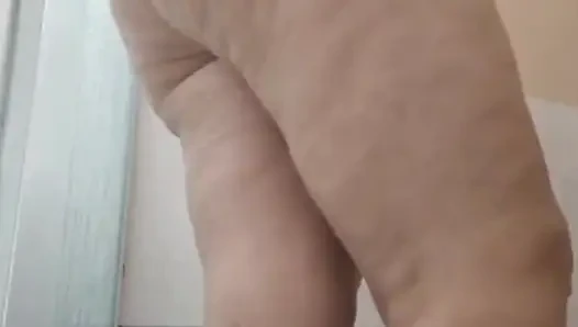 My stepmom taking a shower after fucking, to get the cum out of her.