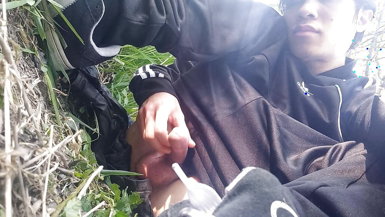 Gay boy Jon Arteen, wearing adidas tracksuit Campus sneakers, gets a hard-on outdoors, jerks off, squirts big cumshots before cl