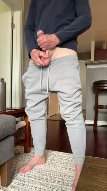 Standing and stroking my hard cock and showing my big bouncing low hanging balls because its hot and its fun. Bonus bare feet for admirers of dudes feet out there. LMK if you like vids like this.