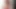 Brunette ladyboy in red dress plays with her big tits and