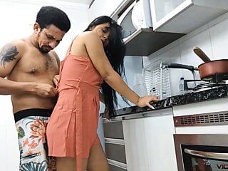 My uncle punching his girlfriend's pussy in the kitchen