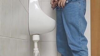 Risky jerk in public urinal at work