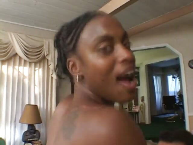 Horny ebony sits on a big white dick and fucks it hard with her pussy