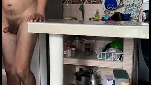 Stepmom masturbates in the kitchen with her huge tits