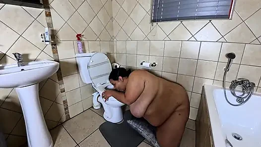Playing with my fat pussy while licking the toilet