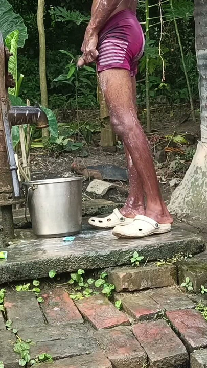 Black mature man bath in desi style. Showing big dick. | Clip 1