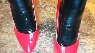 Alice Latexy models in stilettos and black and red latex (aka Latexdesires)