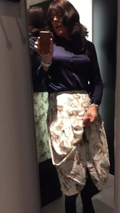 relaxing in a new pleated skirt
