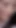 Emotional moment from "As a horny slut the naughty brunette enjoys sucking cum from two large dicks"