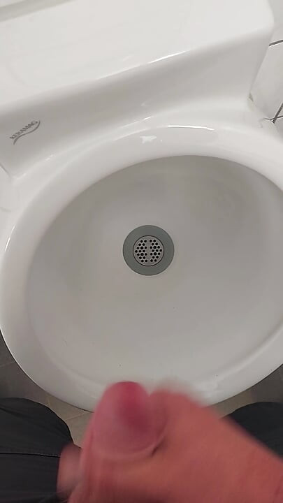 Moaning daddy has a lot of pressure and milks his cock in the public toilet