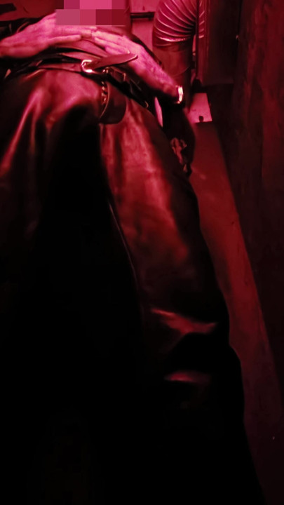 I show you my leather bulge in the corner of the darkroom, and then pull out my hard cock for you.