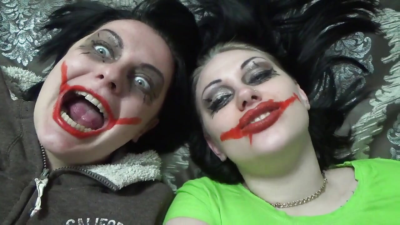 Two crazy clown girls dangle you above their hungry mouths before fighting over who will eat you alive