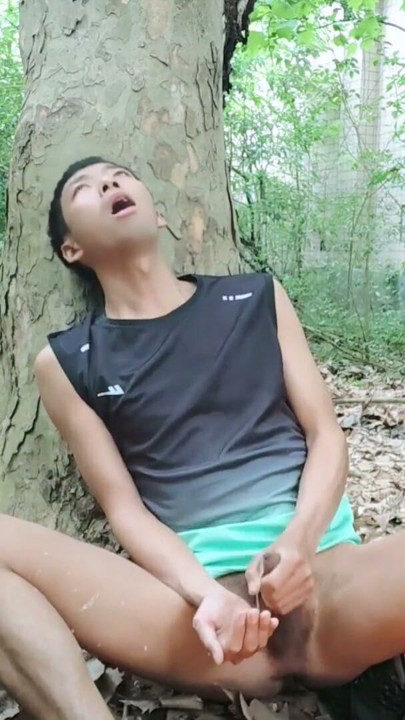 A mischievous Asian boy masturbates, moaning and ejaculating in the atrium garden of an abandoned hotel | Clip 2