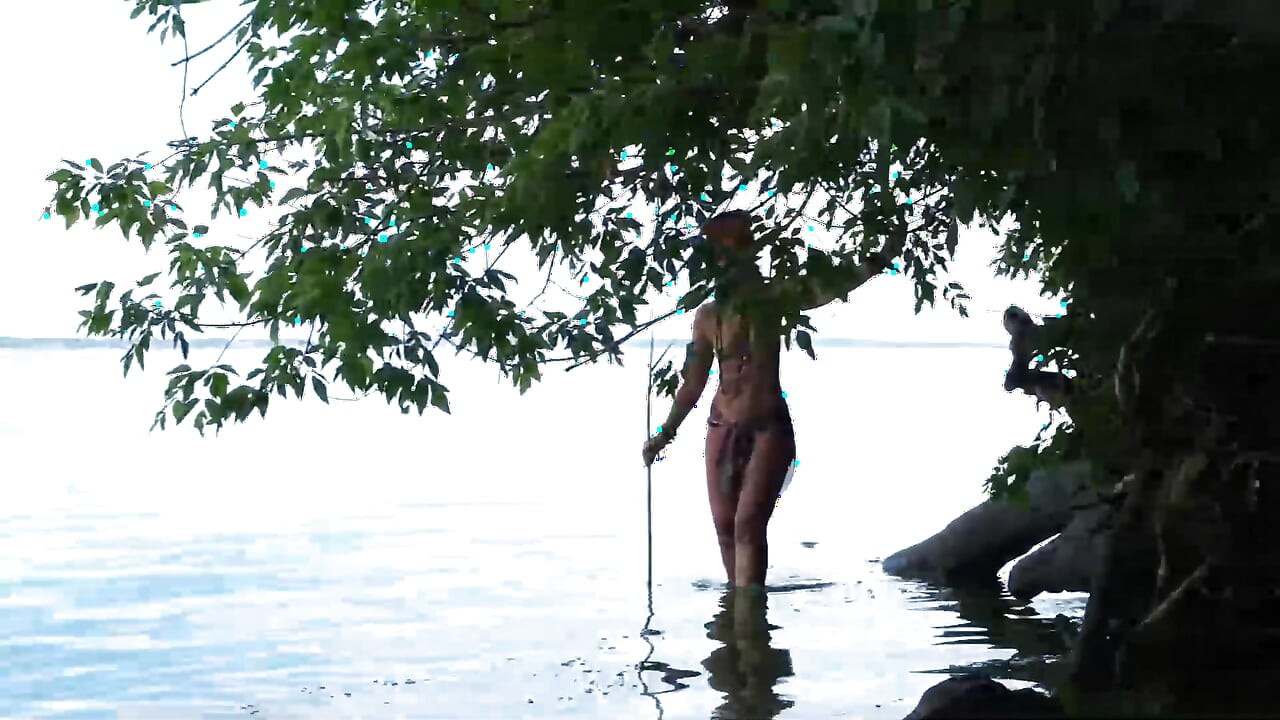 Fishing with harpoon in topless