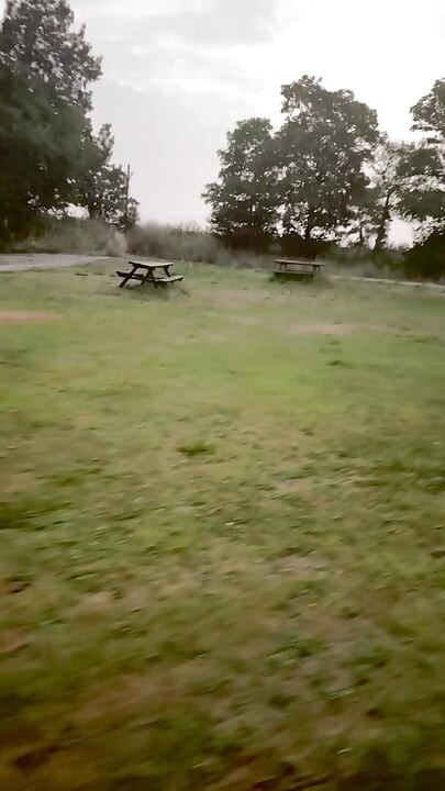 Naked in park standing on benches naked vehicles pass close