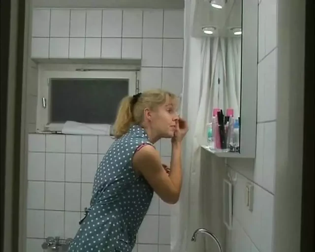 Real German with small tits masturbates to porn with long sex toy