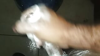 Guy in the shower soaps and masturbates by taking milk out of penis