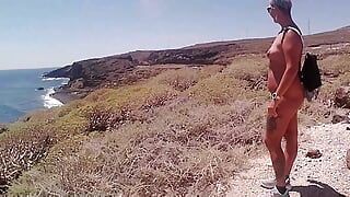 Couple Is Hiking Naked Near the Coast