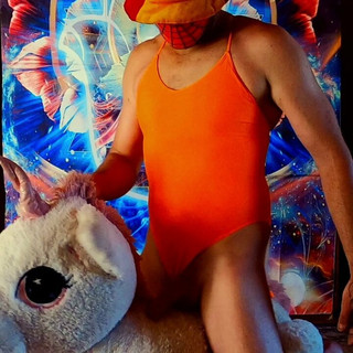 Riding my unicorn in my orange one piece swimsuit