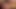 A red-haired woman enjoys an exquisite sexual encounter in a luxurious hotel room.