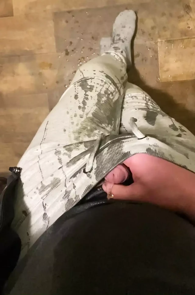 Self piss in grey tracksuit and socks